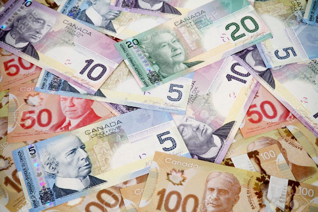 16615862-Big-pile-of-money-Canadian-dollars-Stock-Photo-canada.jpg